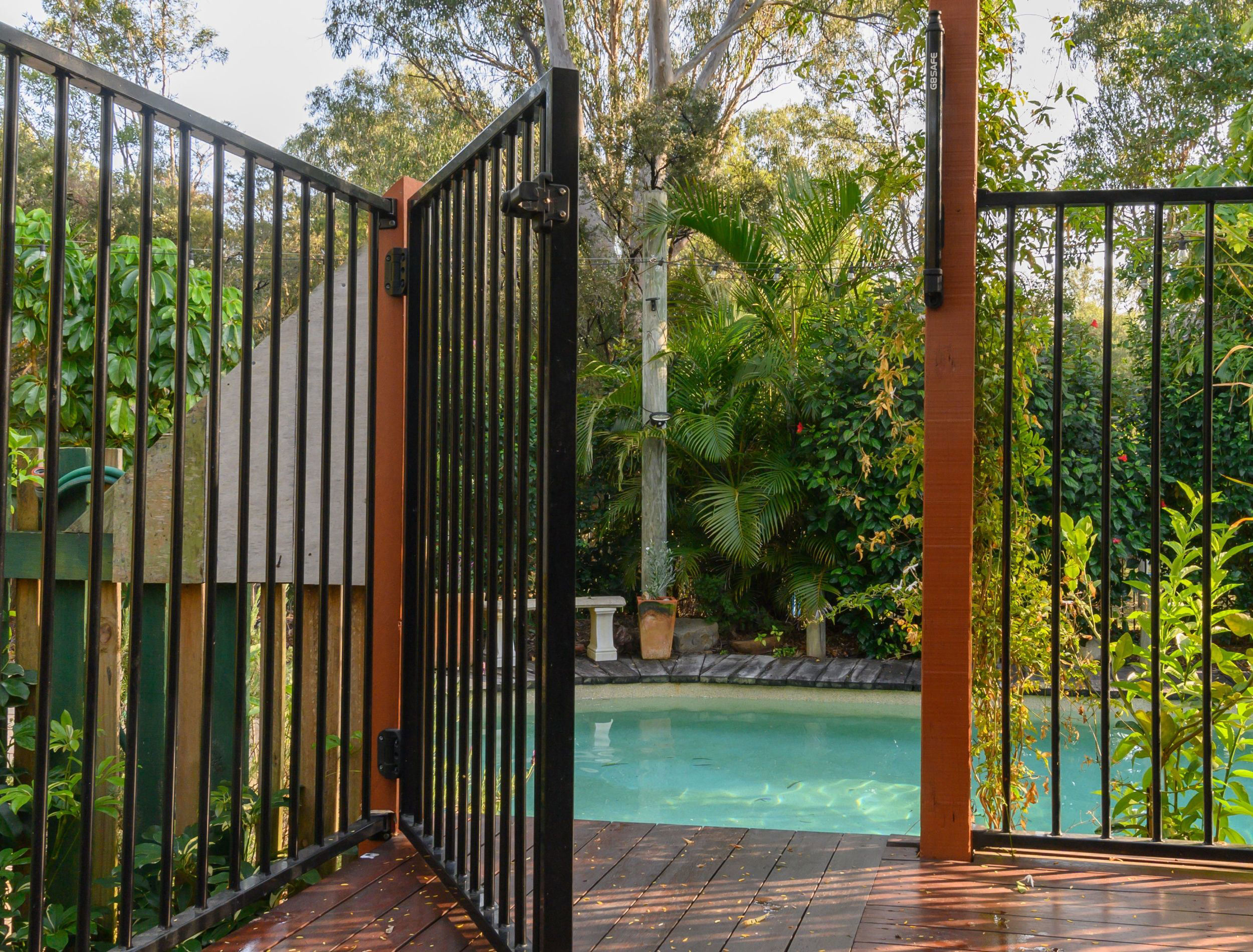 10 Pool Fence Ideas to Update Your Backyard