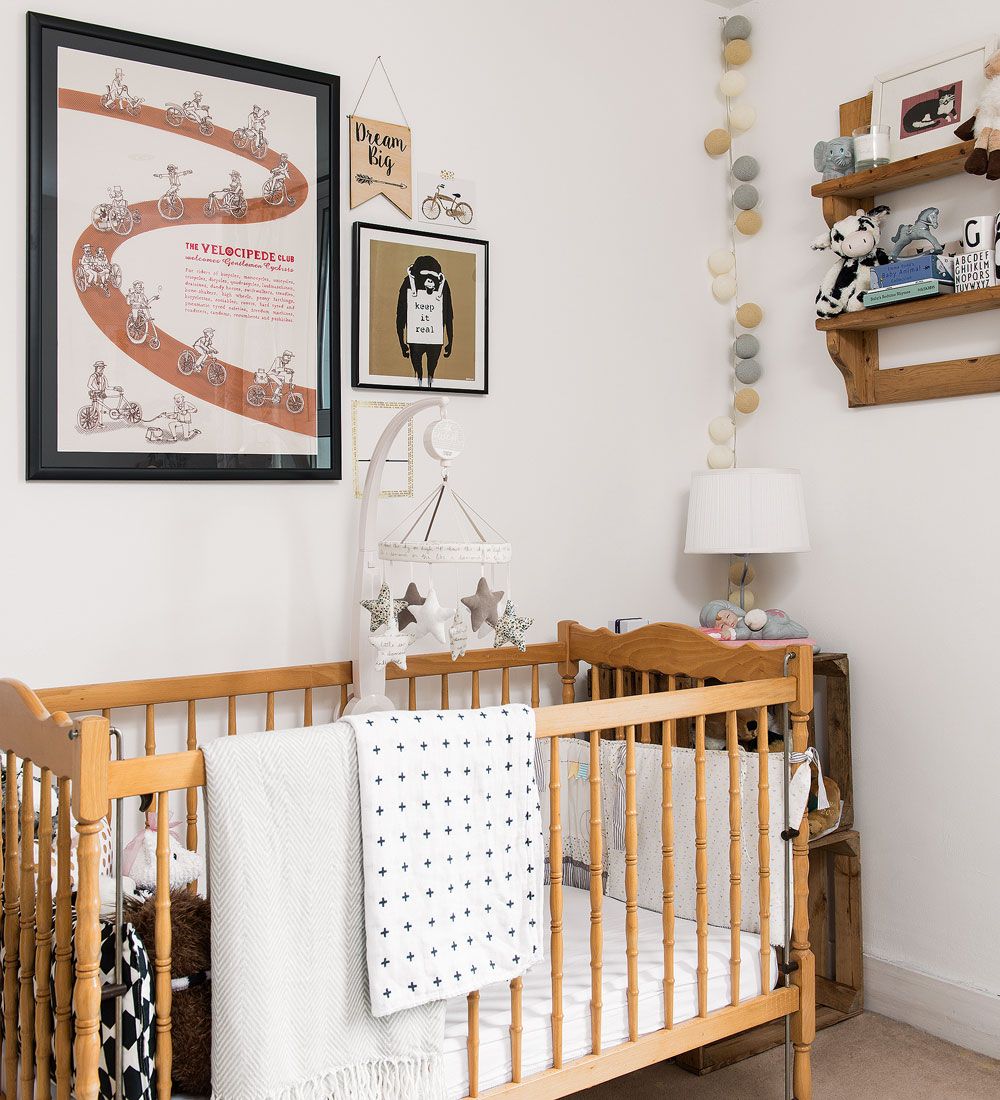<p>                     If you're looking to add subtle tones to a white nursery without having to add an accent colour look to wooden furniture to do the job. Natural wooden finishes help to add warmth to the look without the need for adding colour.                   </p>                                      <p>                     This fine example shows how a wooden cot and wall shelving made in wood can instantly inject interest to an all white room. This beautifully styled scheme is ideal for a gender neutral nursery.                   </p>