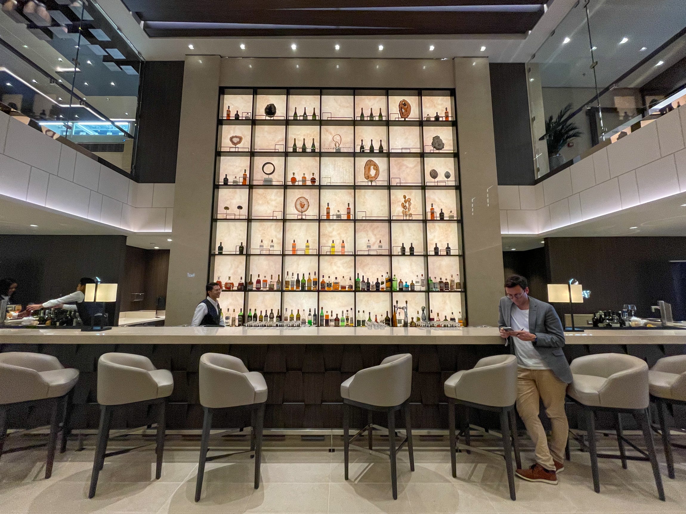 <p>In place of the typical cruise atrium, the "Lobby Bar" looks more like an actual hotel bar.</p>