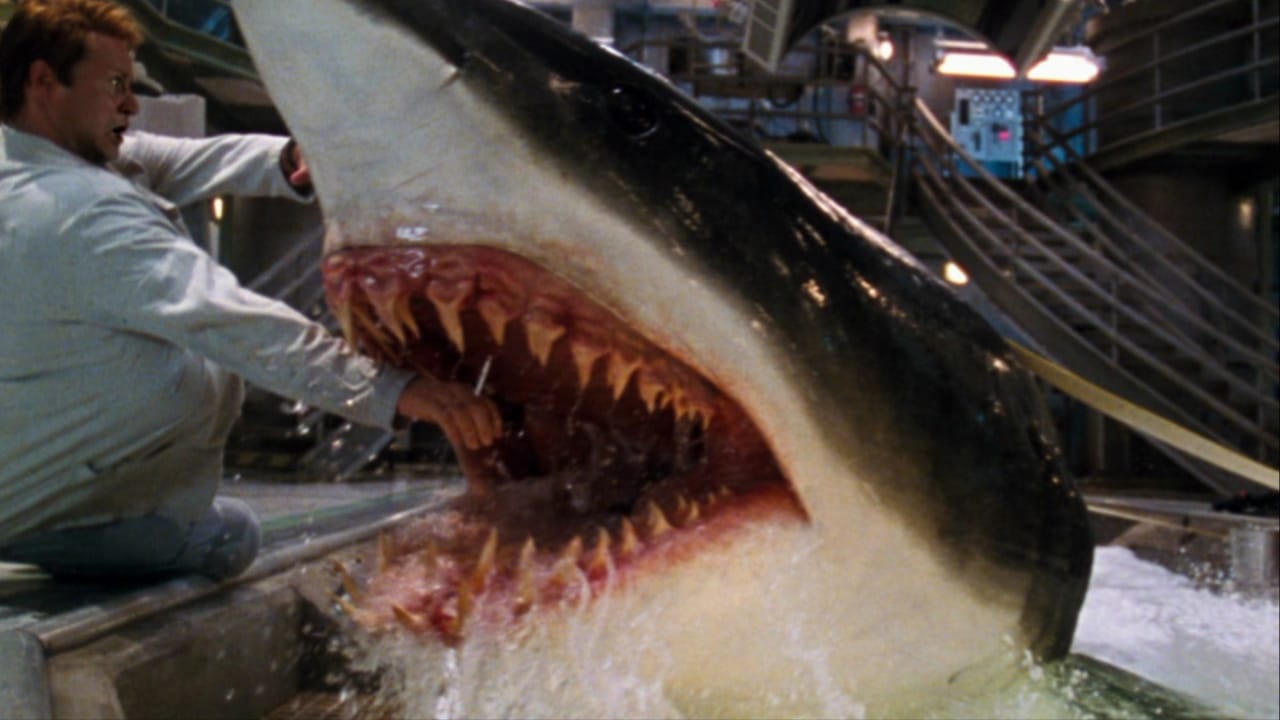 <p class="p1">Speaking of <i>Jaws</i> rip-offs, <i>Deep Blue Sea</i> understands that no one can make a straightforward shark movie to rival the 1975 masterpiece. Instead, Finnish action director <a href="https://wealthofgeeks.com/film-faves-that-directors-wish-they-could-disown/" rel="noopener">Renny Harlin</a> goes for a dumb and fun approach for his movie about sharks engineered with super-brains. The screenplay by Ducan Kennedy, Donna Powers, and Wayne Powers won’t blow the minds of any viewer, but it does make for a good time, thanks to a likable cast that includes Thomas Jane, Samuel L. Jackson, and a delightful LL Cool J.</p>