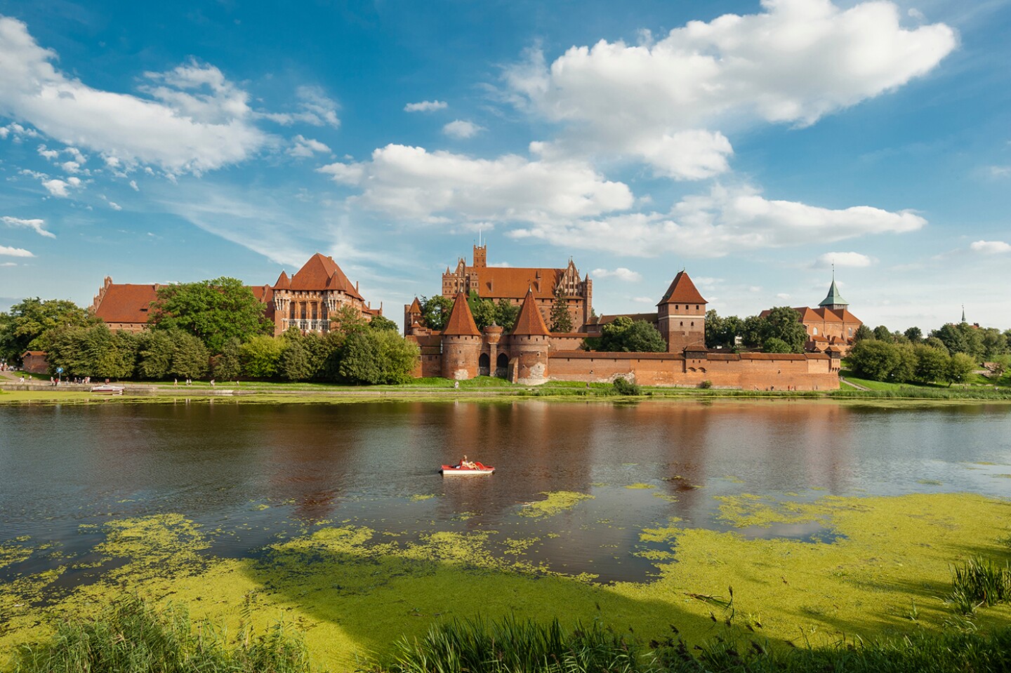 <h2>12. Malbork Castle</h2> <p><i>Malbork, Poland</i></p> <p> Also known by a much longer name—<a class="Link" href="https://www.afar.com/places/malbork-castle-malbork" rel="noopener">The Castle of the Teutonic Order in Malbork</a>—this is the largest brick fortress complex in the world, sprawling across 52 acres along the banks of the Nogat River in northern <a class="Link" href="https://www.afar.com/travel-guides/poland/guide" rel="noopener">Poland</a>. (Catch the highlights with an audio guide or, in the summer months, English-language guided tours.) Construction began in 1309, with a high castle and chapel fortified by moats and several defensive walls. In the 14th century, a low castle was added, along with several outbuildings. </p> <p>The entire complex was virtually destroyed during heavy fighting in World War II; painstakingly rebuilt to its former glory, it’s now a museum and UNESCO World Heritage site. The castle’s collections of amber, original 14th- and 15th-century furnishings, and medieval tombstones are nearly as splendid as its architectural details: towering arched ceilings, colorful frescoes, intricate tile work, and stained glass.<br> </p> <h3>How to visit Malbork Castle</h3> <p><a class="Link" href="https://zamek.malbork.pl/en/home/" rel="noopener">Malbork</a> is a 30-minute train ride from Gdansk or around 2.5 hours from Warsaw; from the station, it’s about a 15-minute walk (or quicker taxi ride) to the castle.</p>
