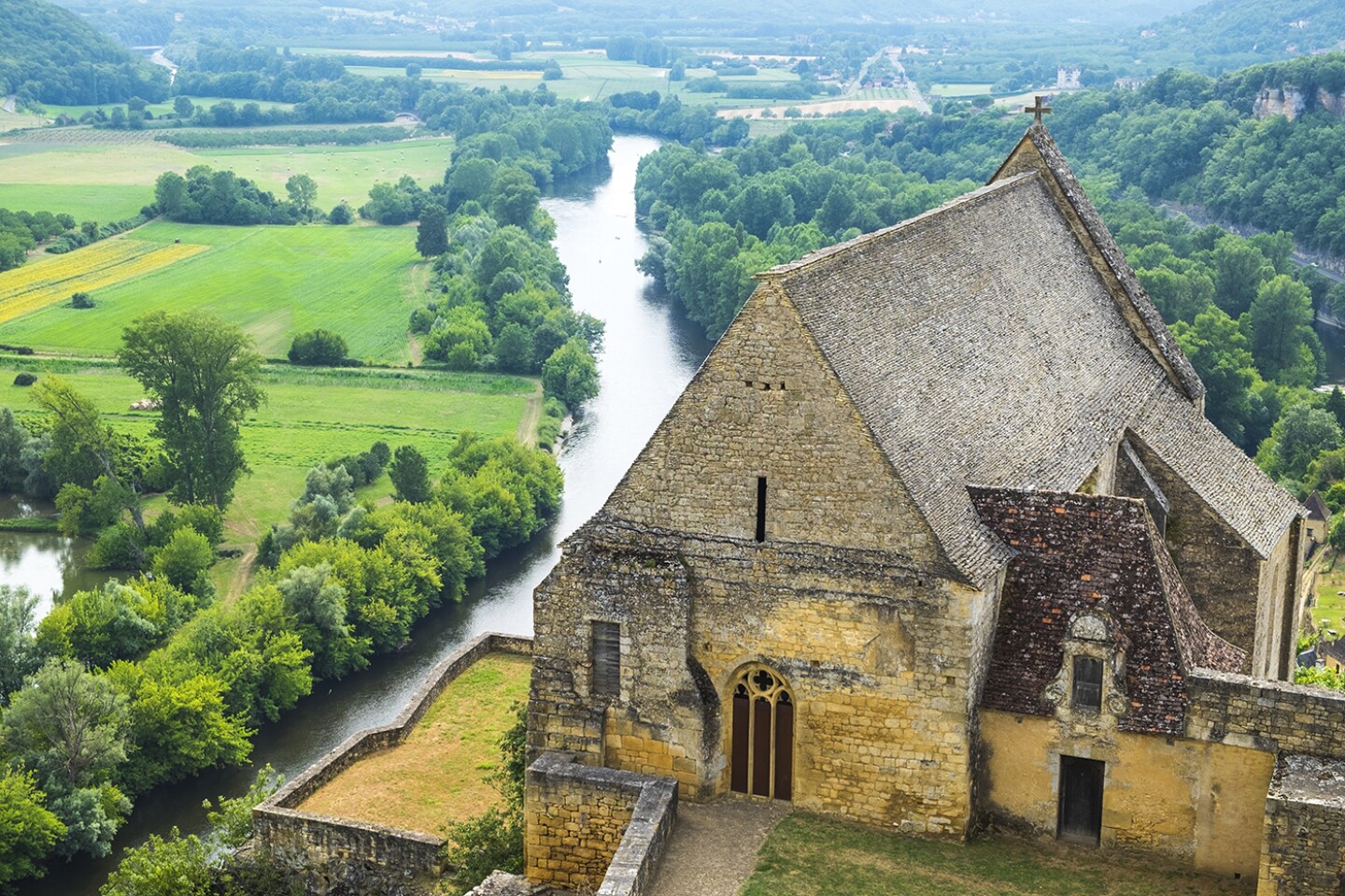 <h2>7. Château de Beynac</h2> <p><i>Beynac-et-Cazenac, France</i></p> <p> This 12th-century fortress may not rank among the prettiest of <a class="Link" href="https://www.afar.com/magazine/beautiful-castles-in-france-that-you-can-visit-1e31e5cc-93df-4ba3-ad6c-18134d7338e6">France’s many castles</a>, but its towering position, atop a sheer, 500-foot limestone cliff above the Dordogne River, certainly stands out. (Don’t miss the views from atop the battlements.) A double crenellated wall and twin moat protected <a class="Link" href="https://chateau-beynac.com/?lang=en" rel="noopener">Château de Beynac</a> during the 100 Years War, and it’s one of the best-preserved in southwest <a class="Link" href="https://www.afar.com/travel-guides/france/guide" rel="noopener">France</a>’s Dordogne Valley. Pick up the audio tour and wander the austere, sparsely furnished rooms of the fortification, including the ancient keep, 13th-century kitchens, and the oratory, lined with 15th-century frescoes. Later rooms date from the 17th century and are decorated with ornate tapestries from the period.</p> <h3>How to visit Château de Beynac</h3> <p>You’ll need a car to get to Château de Beynac; there’s parking next to the castle or it’s a 15-minute walk up from the pretty village of Beynac-et-Cazenac, about a 2.5-hour drive east from <a class="Link" href="https://www.afar.com/travel-tips/the-essential-guide-to-bordeaux" rel="noopener">Bordeaux</a>. </p>