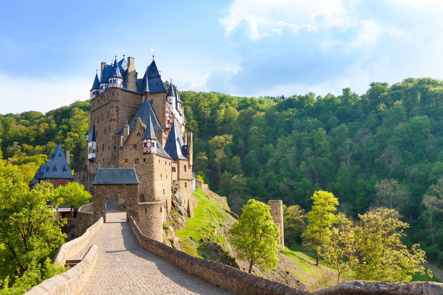 <h2>6. Burg Eltz (Eltz Castle)</h2> <p><i>Wierschem, Germany</i></p> <p> Owned by the same family since it was built nearly 900 years ago, the beautifully preserved Burg Eltz—with eight soaring turreted towers, oriel windows, gables, and half-timber frames—looks straight out of a fairy tale. It juts out from a 230-foot-tall rock, surrounded by forest, deep in an isolated side valley of the Moselle River. A required 40-minute guided tour, in English, leads you through period rooms decorated with original 15th-century murals, tapestries, and furnishings, and vaulted halls lined with medieval armor and weaponry. The treasury, filled with gold and silver historical artifacts, can be visited independently.<br> </p> <h3>How to visit Burg Eltz</h3> <p><a class="Link" href="https://burg-eltz.de/en/homepage" rel="noopener">Burg Eltz</a> is open from April to November. A seasonal Burgenbus (castle bus) departs from several area train stations on weekends and holidays; the closest is Hatzenport, about a 20-minute ride. Hatzenport is less than 90 minutes by train from Cologne (with a change of trains in Koblenz). There are also multiple hikes to the castle from nearby towns; the most popular is from Moselkern (under 2.5 hours by train from Cologne), a moderately challenging 45-minute climb. </p>