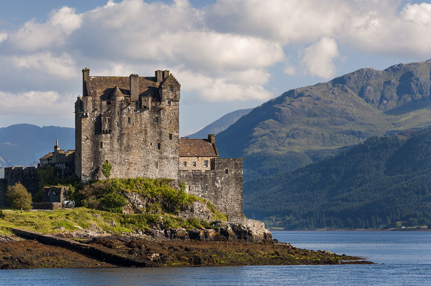 <h2>4. Eilean Donan Castle</h2> <p><i>Dornie, Scotland</i></p> <p> Fans of <i>Highlander</i> or James Bond’s <i>The World Is Not Enough</i> will likely recognize this picturesque <a class="Link" href="https://www.afar.com/travel-tips/the-essential-guide-to-the-highlands" rel="noopener">Scottish Highlands</a> castle, set on a small islet encircled by three sea lochs and accessible only by a stone footbridge. First built in the 13th century, <a class="Link" href="https://www.afar.com/places/eilean-donan-castle-dornie" rel="noopener">Eilean Donan Castle</a> served variously as a fortress, residence, and garrison during its long history before being almost entirely destroyed during the Jacobite rising of 1719. It lay in ruins for nearly 200 years until 1911, when a decades-long reconstruction began. Today, the castle, which you can visit with an audio guide, is largely a re-creation of what it looked like in the 18th century, complete with rich Jacobite-era decor, weapons, and artifacts.<br> </p> <h3>How to visit Eilean Donan Castle</h3> <p>Note that <a class="Link" href="https://www.eileandonancastle.com/" rel="noopener">Eilean Donan</a> is closed in January. From Inverness, about two hours away, day tours and public buses offer direct access to the castle. </p>