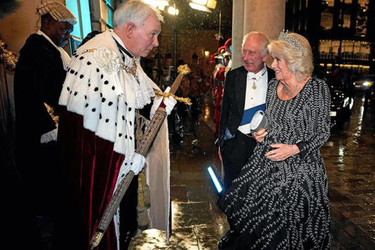 KIRSTY WIGGLESWORTH/POOL/AFP via Getty King Charles and Queen Camilla participate in the Pearl Sword ceremony on Oct. 18, 2023