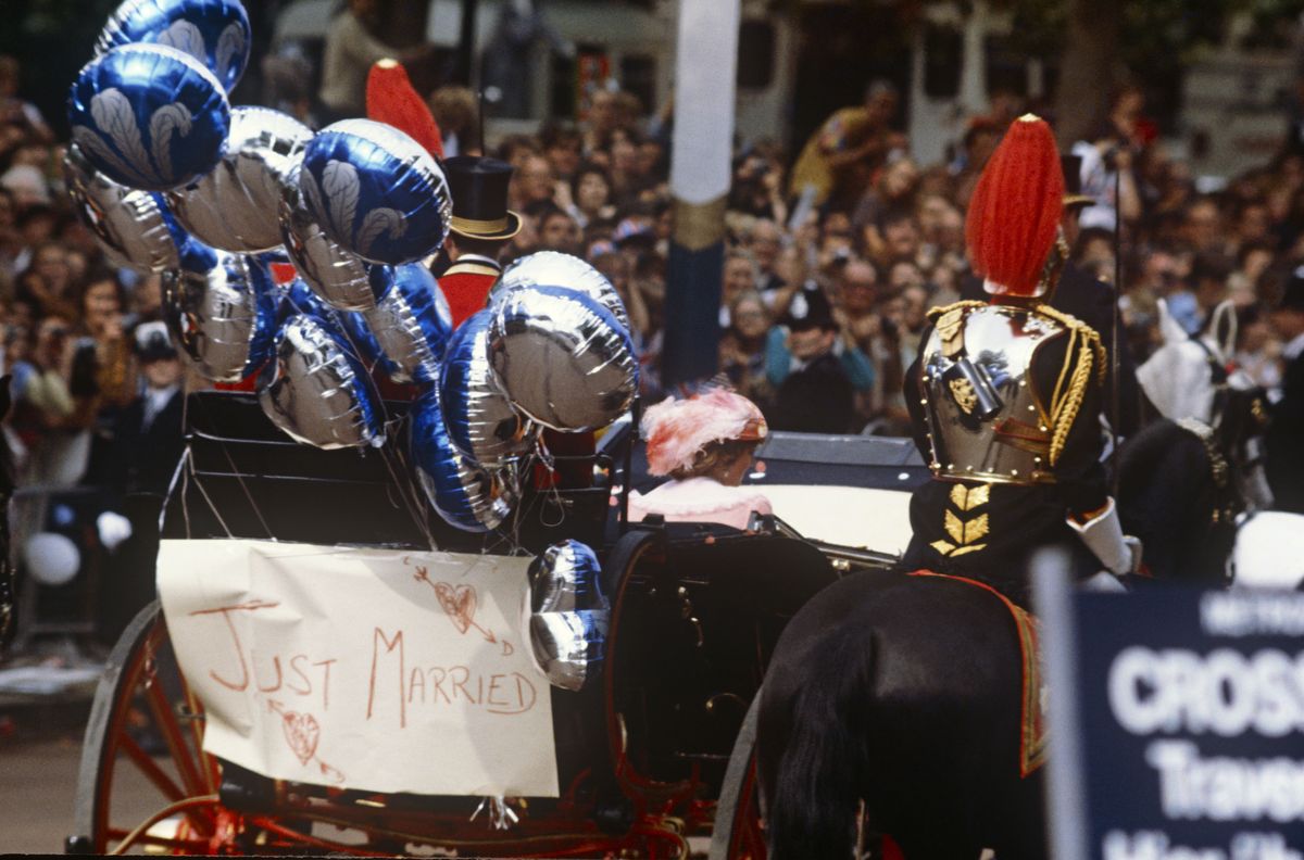 <p>The newlywed's carriage was decorated with a "Just Married" sign, as well as mylar balloons with the Prince of Wales feather on them.</p>