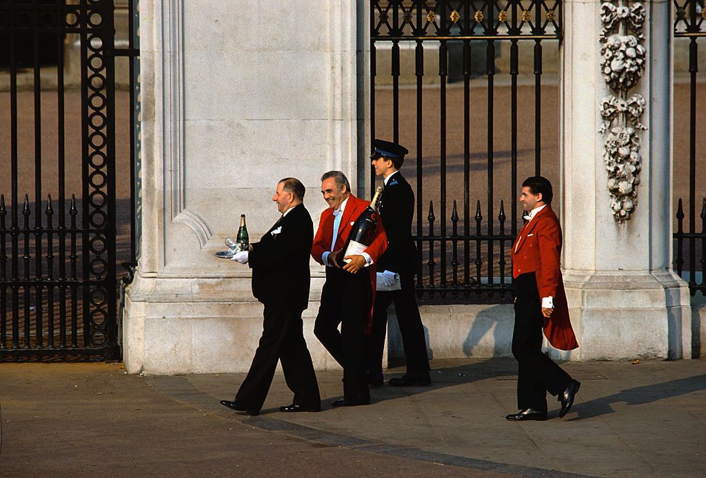 <p>As the reception commences, royal staffers are spotted carrying bottles of champagne into Buckingham Palace.</p>
