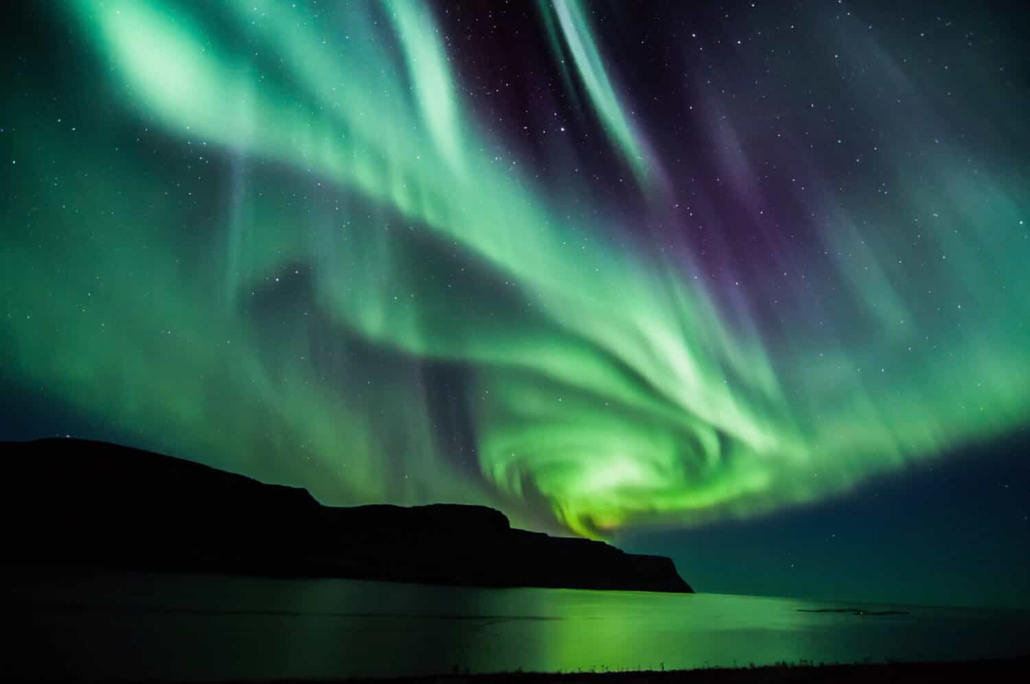 An Aurora Borealis Spiral in Iceland. <a>©Mike-Hubert.com/Shutterstock.com</a>