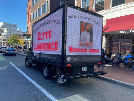 A truck driving around Harvard's campus identifies people who signed onto a controversial letter supporting Palestinians in the wake of an attack by Hamas.