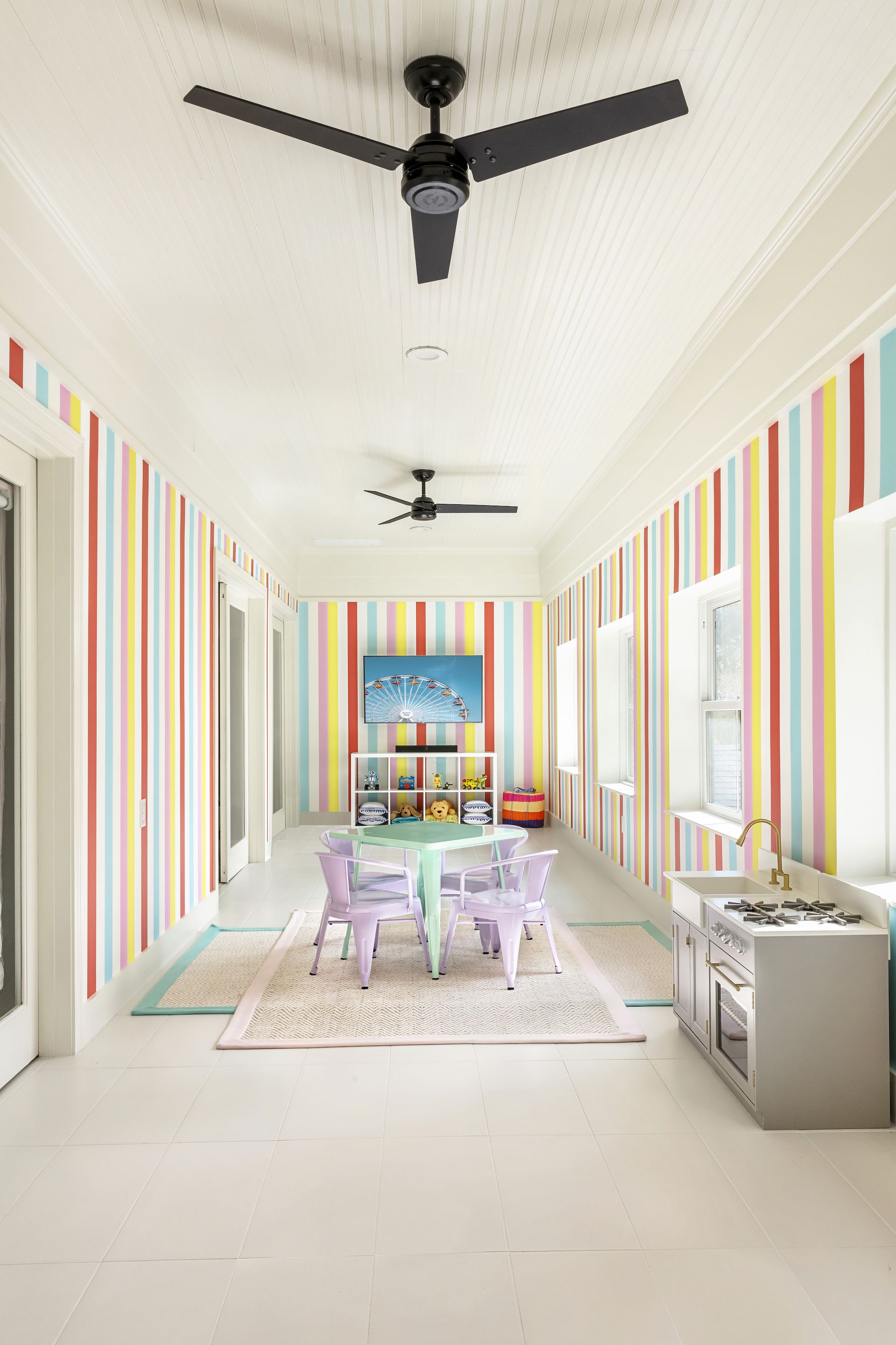 <p>                     Decorating with stripes is a fun but classical way to decorate a playroom, and it can allow you to add candy stripes to keep the space feeling light and bright. In a long, narrow room, it's a good way to alter its proportions, exaggerating the height of the space.                   </p>                                      <p>                     'Our clients really wanted the space to be fun and playful, and the Katie Kime wallpaper was the perfect backdrop,' says Stephanie Lindsey, principal designer at Etch Design Group.                   </p>