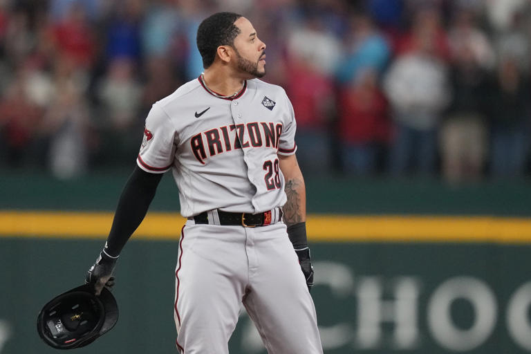 Arizona Diamondbacks designated hitter Tommy Pham (28) reacts after being picked off at second base by Texas Rangers shortstop Corey Seager to end the top of the sixth inning in Game 2 of the World Series, Saturday, Oct. 28, 2023, in Arlington.