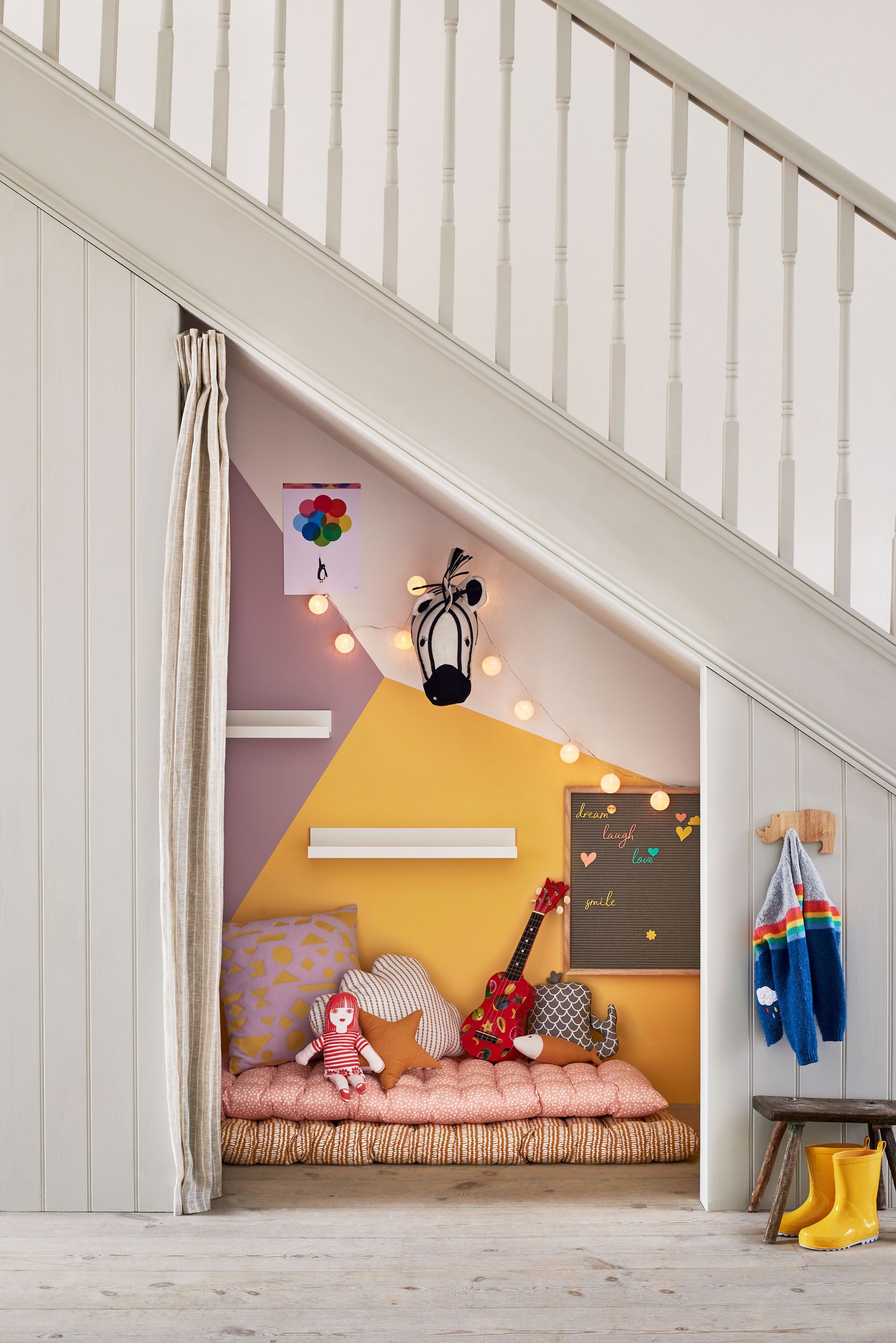 <p>                     If you have been browsing small bedrooms and despair of finding playroom space, think laterally. Kids love secret nooks and crannies, so if you’re short on space and can’t spare a room to turn into a playroom then consider converting the area under the stairs.                   </p>                                      <p>                     Paint is your friend here – create a cozy area with two or three favorite colors – and fill it with a squishy mattress, comfy shaped pillows and plenty of fairy lights, strung well out of reach of really young children. If you don’t have an electric point then use battery-operated lights instead, but do ensure safety of really little ones is uppermost in your mind when designing with string lights.                   </p>