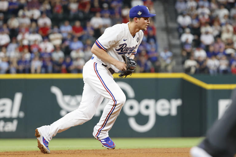 Texas Rangers shortstop Corey Seager (5) fields a ground ball out from Arizona Diamondbacks' Evan Longoria during the fifth inning in Game 2 of the World Series, Saturday, Oct. 28, 2023, in Arlington.