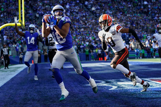 Seattle Seahawks wide receiver Tyler Lockett (16) catches a touchdown pass in front of Cleveland Browns cornerback Greg Newsome II (0) in the first half of an NFL football game, Sunday, Oct. 29, 2023, in Seattle. (AP Photo/Lindsey Wasson)