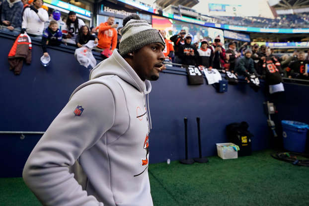 Injured Cleveland Browns quarterback Deshaun Watson walks onto the field during warmups before an NFL football game against the Seattle Seahawks, Sunday, Oct. 29, 2023, in Seattle. (AP Photo/Lindsey Wasson)