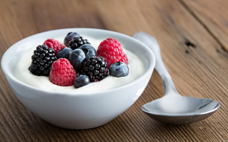 Greek yogurt with a handful of berries makes a great snack - getty