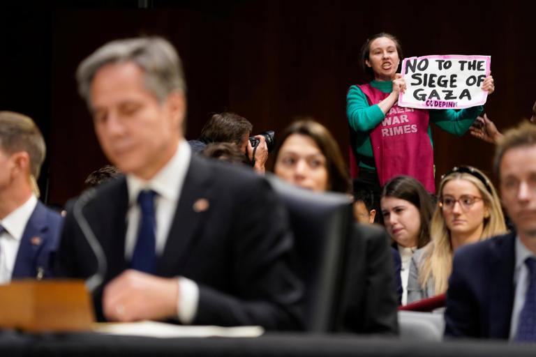 A protestor interupts a hearing as Secretary of State Antony Blinken testifies before the Senate Appropriations Committee on Tuesday, Oct. 31, 2023 in Washington, D.C.