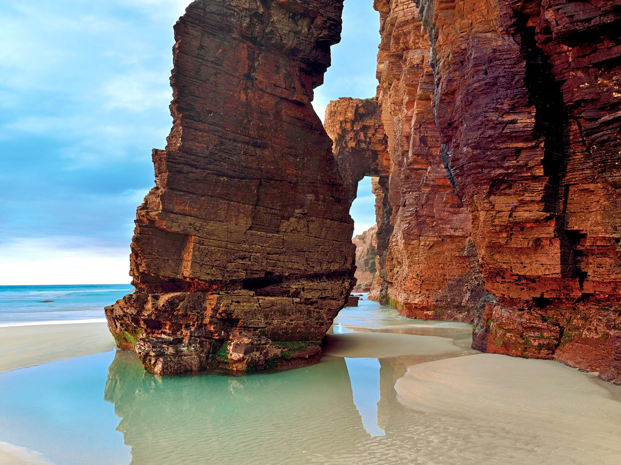 As a destination on Europe's Iberian Peninsula, Spain is renowned for its island paradises and semi-remote sand beaches. We're particularly big fans of Playa de Las Catedrales, a small stretch of sand on the Galician coast where natural stone arches form a walkable "cathedral" at low tide.<p>Sign up to receive the latest news, expert tips, and inspiration on all things travel</p><a href="https://www.cntraveler.com/newsletter/the-daily?sourceCode=msnsend">Inspire Me</a>