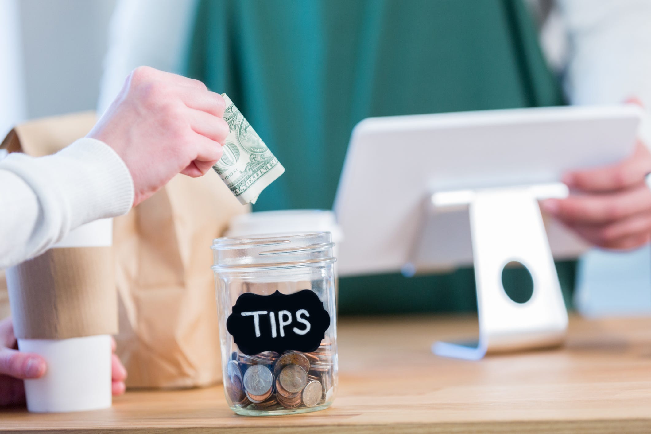 americans are reluctantly spending $500 a year tipping, a new study says.