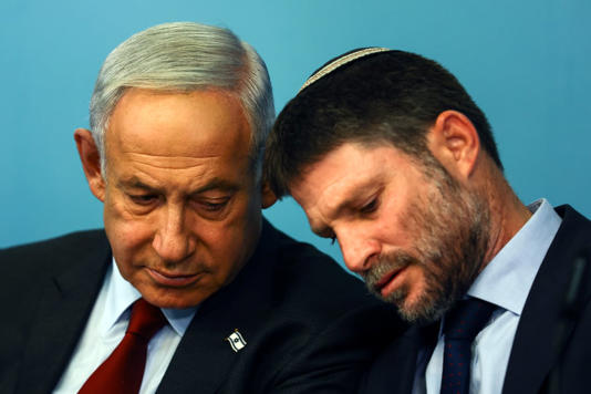 Israeli Prime Minister Benjamin Netanyahu and Israeli Finance Minister Bezalel Smotrich hold a news conference at the prime minister's office in Jerusalem on Wednesday, Jan. 25, 2023. (Ronen Zvulun/The Associated Press)