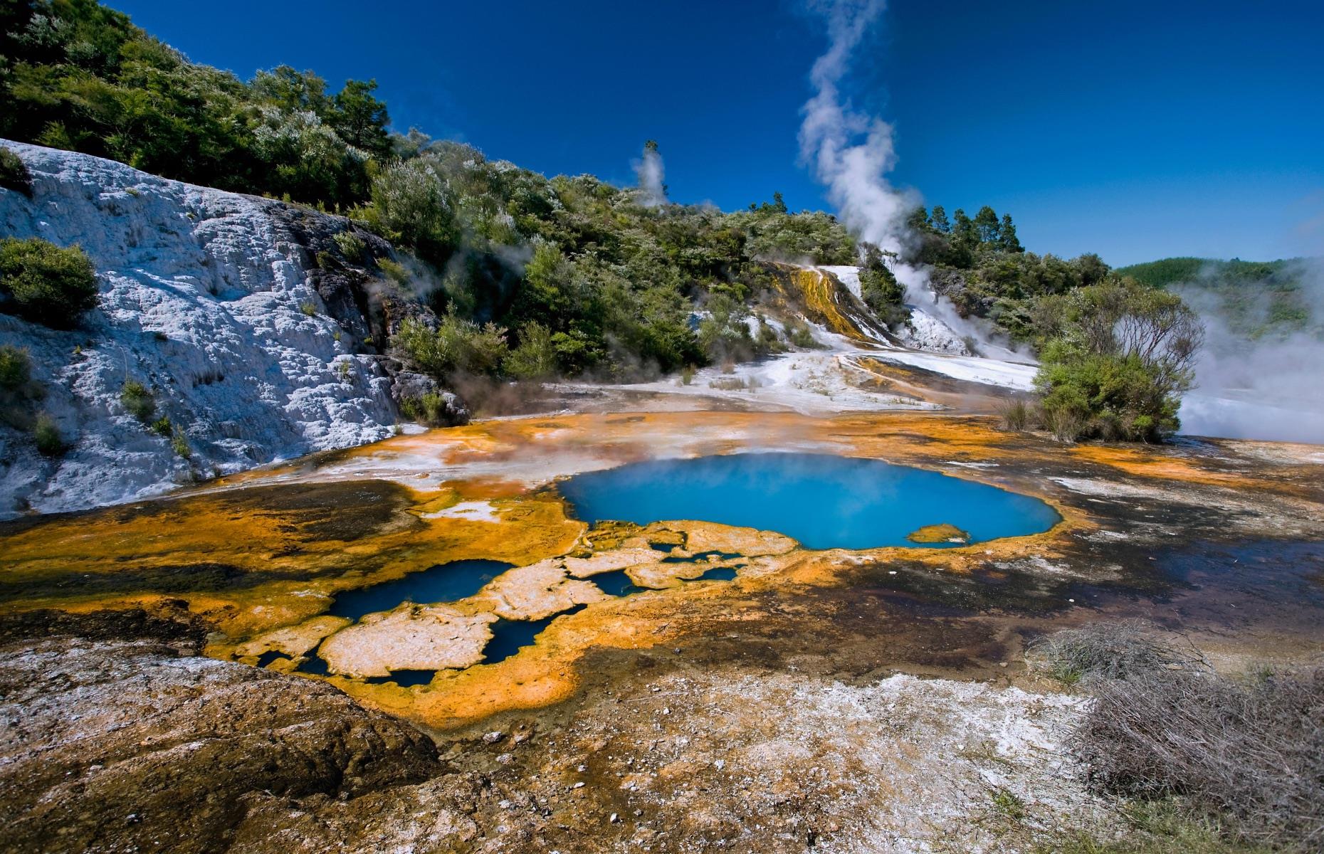 <p>To admire the seismic energy of Mother Nature without the crowds, take the ferry across Lake Ohakuri to the hidden valley of Orakei Korako Geothermal Park. Just as spectacular as Rotorua’s fizzing landscapes, the park’s gigantic, technicolor hot springs, geysers, and mud pools are a bubbling hot soup of geothermal activity. Close to Lake Taupo, the area makes a great addition to an itinerary exploring the region’s other highlights, including Waitomo Caves and Huka Falls.</p>