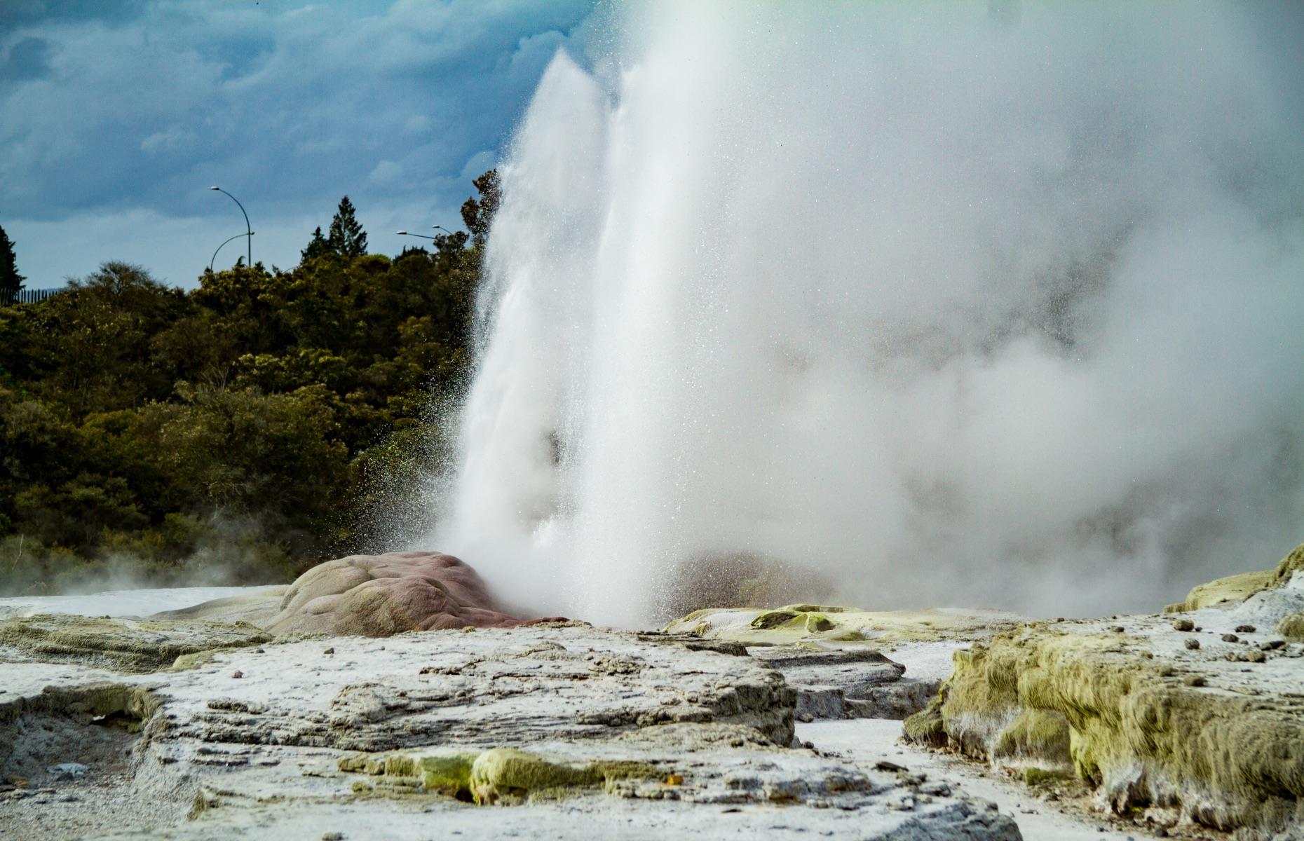 <p>The Rotorua area is jam-packed with geologic marvels, but Pohutu Geyser towers above the rest – suddenly erupting boiling water 98 feet into the air at least once every hour to the delight of onlookers. The largest active geyser in the southern hemisphere, Pohutu is part of Te Puia’s Te Whakarewarewa Geothermal Valley, full of bubbling pools and coursing elemental energy. Look out for the nearby Prince of Wales Feathers geyser, which always shoots water just before its bigger neighbor erupts.</p>