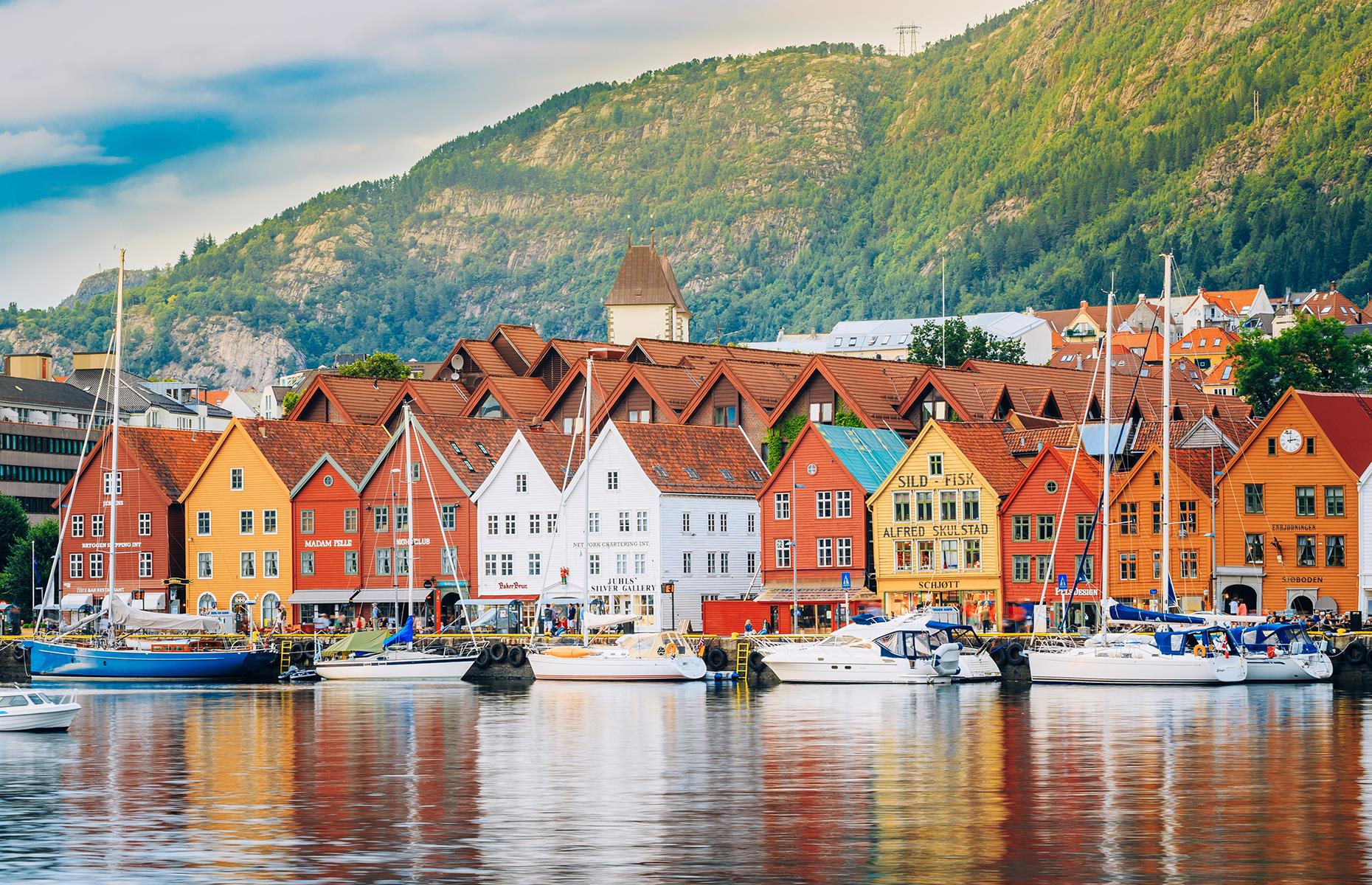 <p>Norway’s second-largest city is in a breathtaking location surrounded by seven towering mountains and impossibly deep fjords. Stroll along Bergen's old wharf past brightly colored wooden houses, and hop on a ferry for a tour of the fjords. A visit to the fish market will whet your appetite for fresh seafood in the city's waterside restaurants.</p>