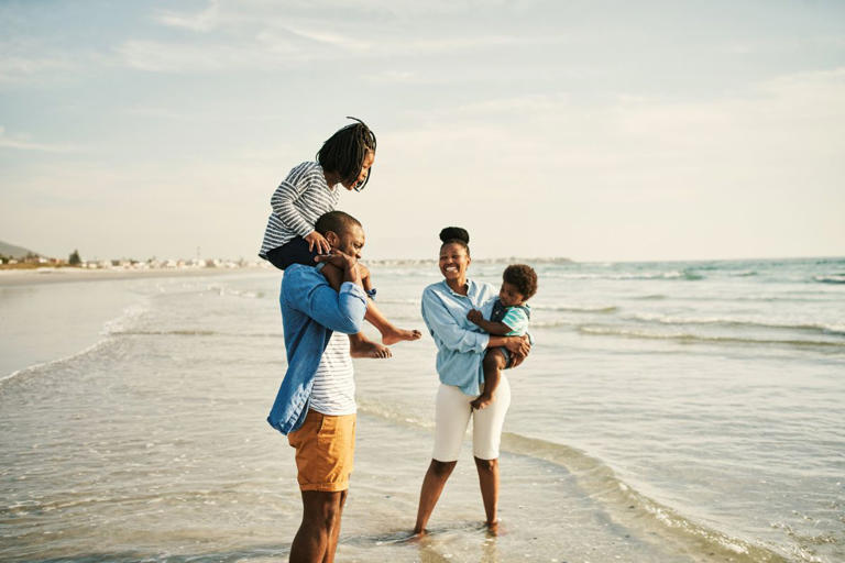 Black family on the beach together