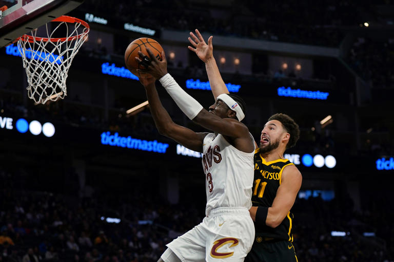 Cleveland Cavaliers guard Caris LeVert (3) drives to the basket as Golden State Warriors guard Klay Thompson (11) defends Saturday in San Francisco.