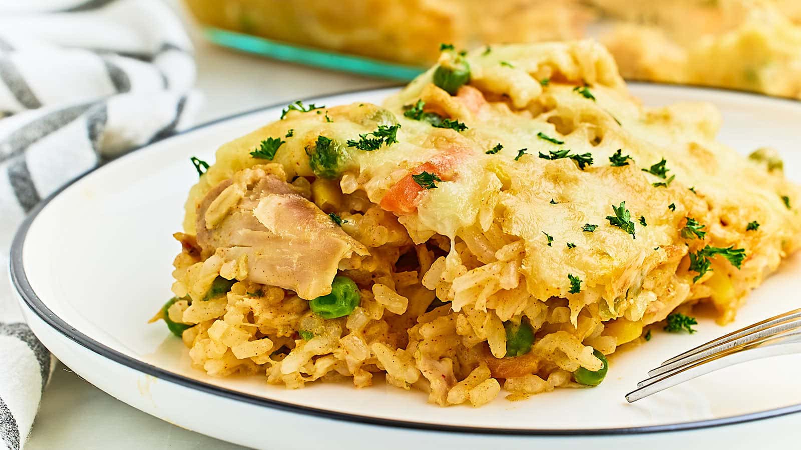 <p>Chicken and Rice Casserole is the perfect comfort food that is both delicious and easy to make. Juicy rotisserie chicken, fluffy rice, and veggies are baked perfectly with bubbly, golden cheese.</p><p><strong>Get the Recipe: <a href="https://cheerfulcook.com/chicken-and-rice-casserole/" rel="noreferrer noopener">Chicken And Rice Casserole</a></strong></p>