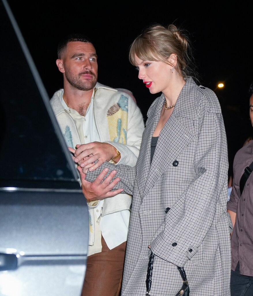 Taylor and Travis spent their first New Year's Eve together, sharing a romantic kiss when the clock struck midnight on Jan. 1.