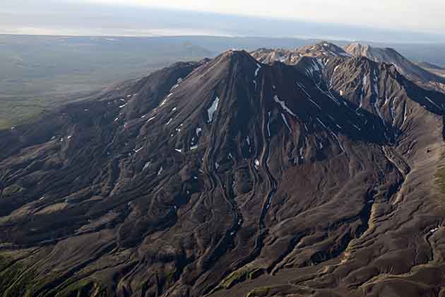 <p><strong>Russia</strong></p>  <p>Despite what you may think, this landform is <em>not </em>the same as California's Death Valley. Not content to let America have all the fun, Russia has its own Valley of Death at the Valley of Geysers in the Kamchatka Peninsula that's arguably deadlier than its American counterpart. However, the danger here lies in the toxic gas released by the volcano — it’s killed all plant and animal life in the valley, and humans notice adverse symptoms immediately upon entering the area. </p> <p>The mile area at the foot of the stratovolcano Kikhpinych is the "Valley of Death" itself where volcanic gases kill anything that enters. In the late 1900s, researchers determined that the trap is created by a toxic mix of hydrogen sulfide, carbon and sulfur dioxide, and carbon disulfide. You don't have to be a chemist to realize that it isn't a friendly mix...</p>