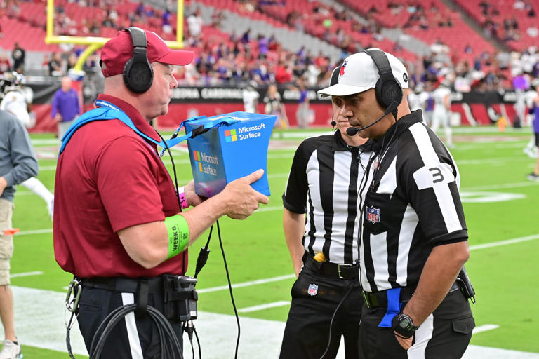 NFL Referee Tra Blake (3) tests the replay system prior to the game between the Arizona Cardinals and the Baltimore Ravens at State Farm Stadium.
