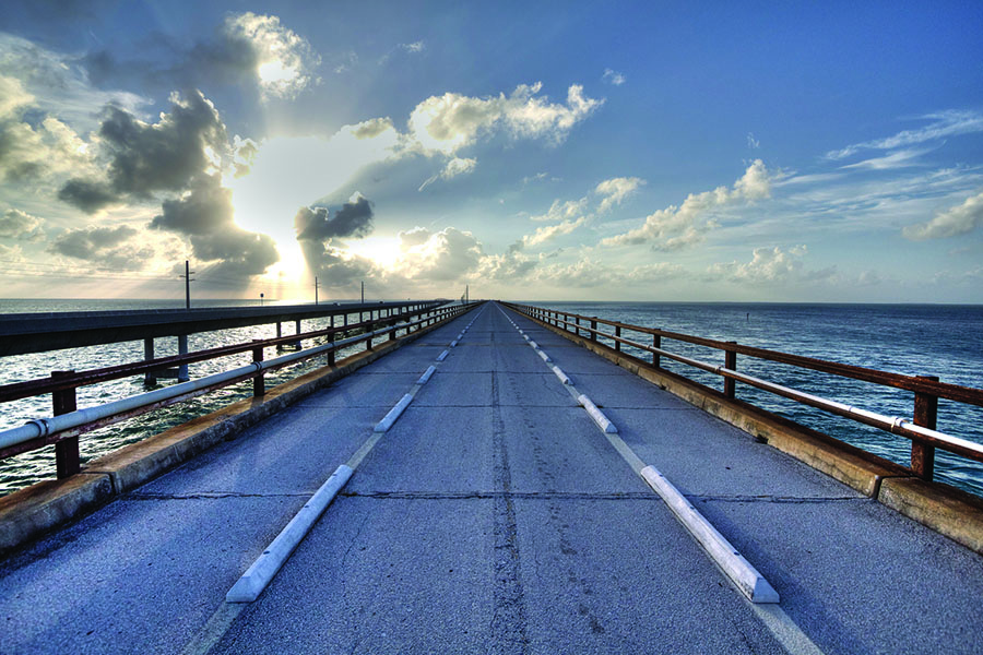 <h4>Florida Keys</h4>  <p>This gorgeous highway runs along the Florida Keys and features the Seven Mile Bridge, one of the longest bridges in the world, as part of its 120-mile span. There are plenty of places to camp down, like <a href="https://www.google.com/url?sa=t&rct=j&q=&esrc=s&source=web&cd=1&cad=rja&uact=8&ved=0ahUKEwii7cP2lbfNAhUJWVIKHUqgCPEQFggfMAA&url=http%3A%2F%2Fwww.grassykeyrvpark.com%2F&usg=AFQjCNEgyqTobFmKphB_QadQa_hXpzWVWg&sig2=rswX98W6zjyk2L6Xwzuwmg">Grassy Key RV Park & Resort</a> or <a href="https://www.google.com/url?sa=t&rct=j&q=&esrc=s&source=web&cd=1&cad=rja&uact=8&ved=0ahUKEwie87eDlrfNAhVEElIKHUUrDigQFggfMAA&url=http%3A%2F%2Fwww.geigerkeymarina.com%2F&usg=AFQjCNHFNzwam2t_5zQnJHXU6cdRfdrvMA&sig2=5VJOp6nJ4L8yRnuzeAsuPA">Geiger Key Marina</a>. The Florida Keys offers plenty of fishing and watersports that you may not have bothered to do with children, but you're free now, so enjoy!</p>  <p>(Image via <a href="https://www.flickr.com/photos/allenmcgregor/8381653821/">Flickr</a>)</p>