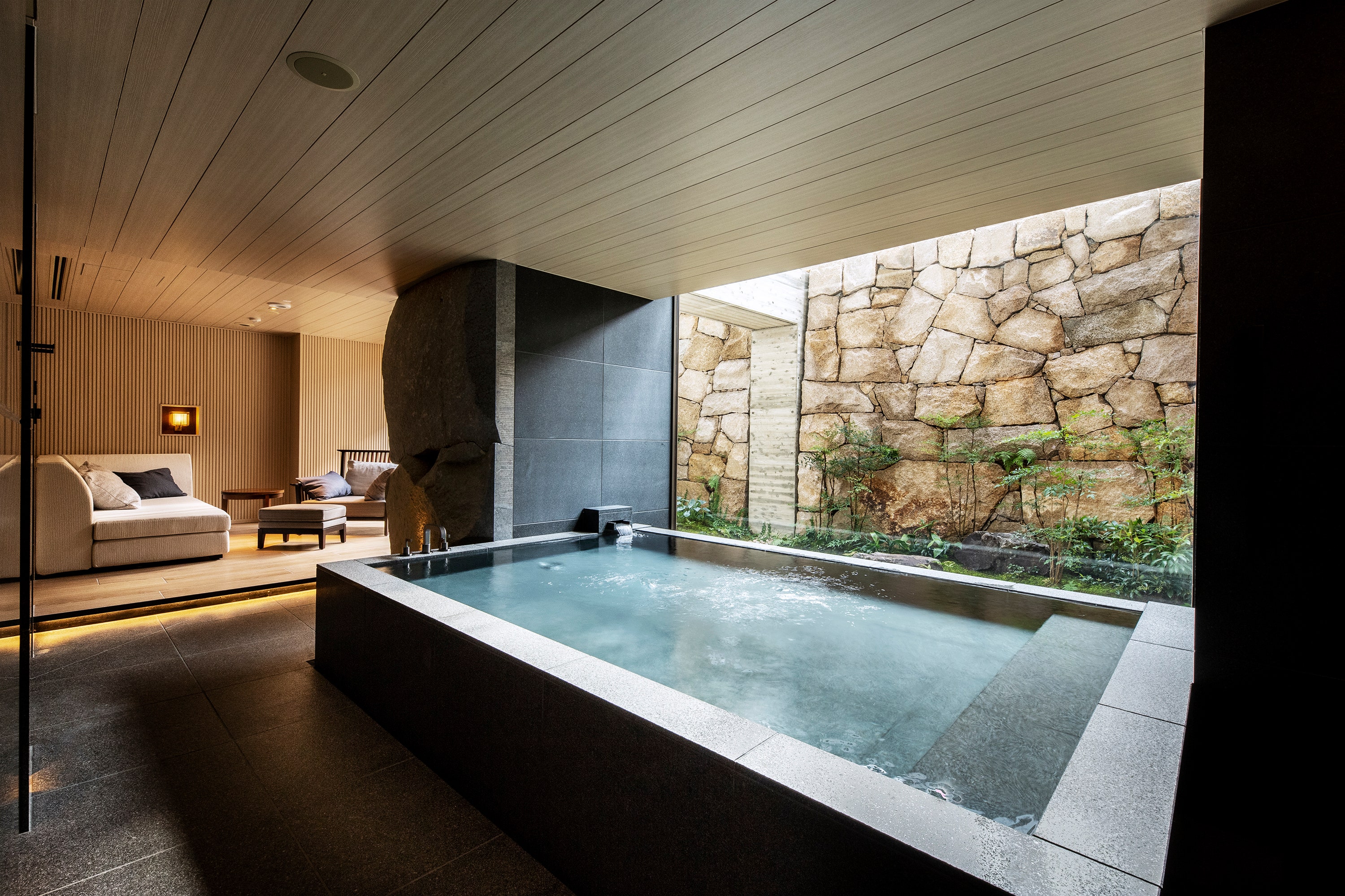 Believed to have healing properties due to their mineral-rich waters, Japanese onsen baths (hot springs) are an integral part of Japanese culture. In the <a href="https://www.hotelthemitsui.com/en/kyoto/rooms-suites/onsen-suite/">Onsen Suite</a> at Hotel The Mitsui, you can experience the ancient wellness practice in your room with an onsen bath on your private outdoor patio. Surrounded by stone lanterns and an intimate Japanese garden, the bath filled with natural spring water sourced onsite is a quiet reprieve in the heart of Kyoto. The Zen atmosphere continues inside the 1087-square-foot suite with separate living and bedroom areas decorated with natural woods.<p>Sign up for our newsletter to get the latest in design, decorating, celebrity style, shopping, and more.</p><a href="https://www.architecturaldigest.com/newsletter/subscribe?sourceCode=msnsend">Sign Up Now</a>