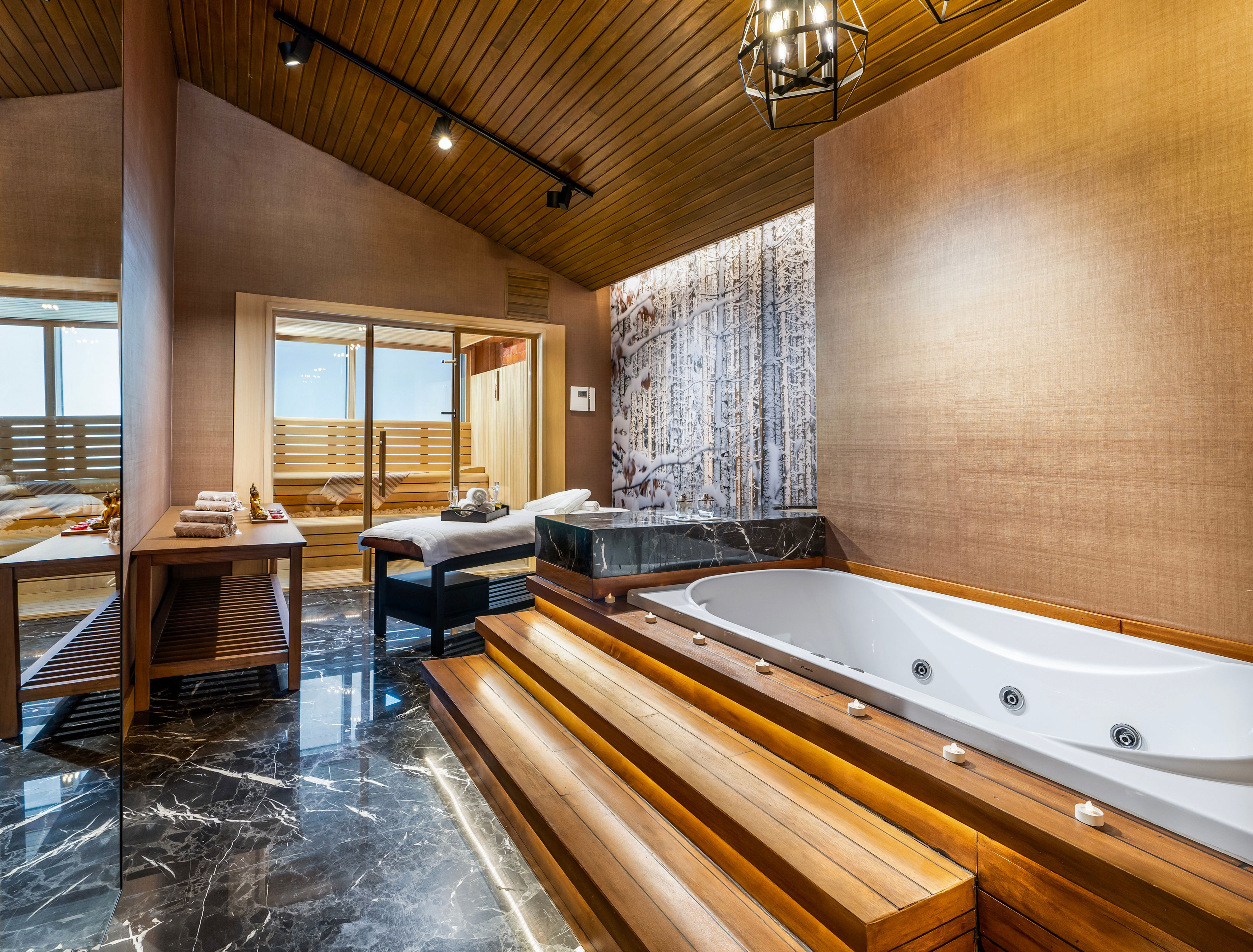The four-bedroom <a href="https://kayahotels.com/en/oteller/kaya-palazzo-ski-mountain-resort/konaklama/palazzo-luxury-chalets">Palazzo Luxury Chalets</a> at this ski resort in Kartalkaya—one of Turkey’s most popular ski destinations—feature a massage room, sauna, and outdoor hot tub. Rustic details like wood-paneled walls and plaid upholstery are balanced with modern wall murals, soaring ceilings, and two-story high windows, making this contemporary chalet the ideal setting for unwinding after a day on the slopes. Further relaxation is found at the <a href="https://kayahotels.com/en/oteller/kaya-palazzo-ski-mountain-resort/spa-fitness">Palazzo Spa & Wellness Center</a> which has Turkish baths, saunas, steam rooms, 11 massage rooms, a fitness center, and a heated pool with views of the surrounding Köroğlu Mountains.<p>Sign up for our newsletter to get the latest in design, decorating, celebrity style, shopping, and more.</p><a href="https://www.architecturaldigest.com/newsletter/subscribe?sourceCode=msnsend">Sign Up Now</a>
