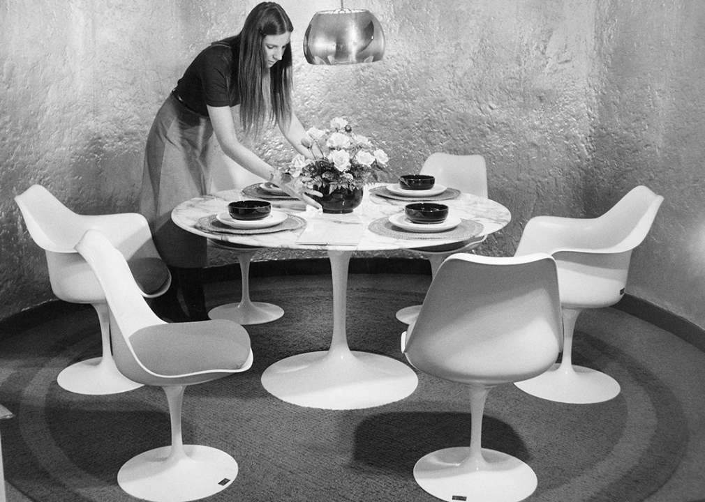 <p>Finnish American designer Eero Saarinen initially created the Tulip table and chairs to avoid the traditionally "ugly, confusing, unrestful world" beneath chairs and tables. The furniture pieces make use of molded fiberglass shells and an aluminum stem.</p>  <p>The pieces were designed for Knoll in 1957 as part of Saarinen's Pedestal collection. Stanley Kubrick's iconic 1968 sci-fi film, "2001: A Space Odyssey," featured a Tulip-style table.</p>