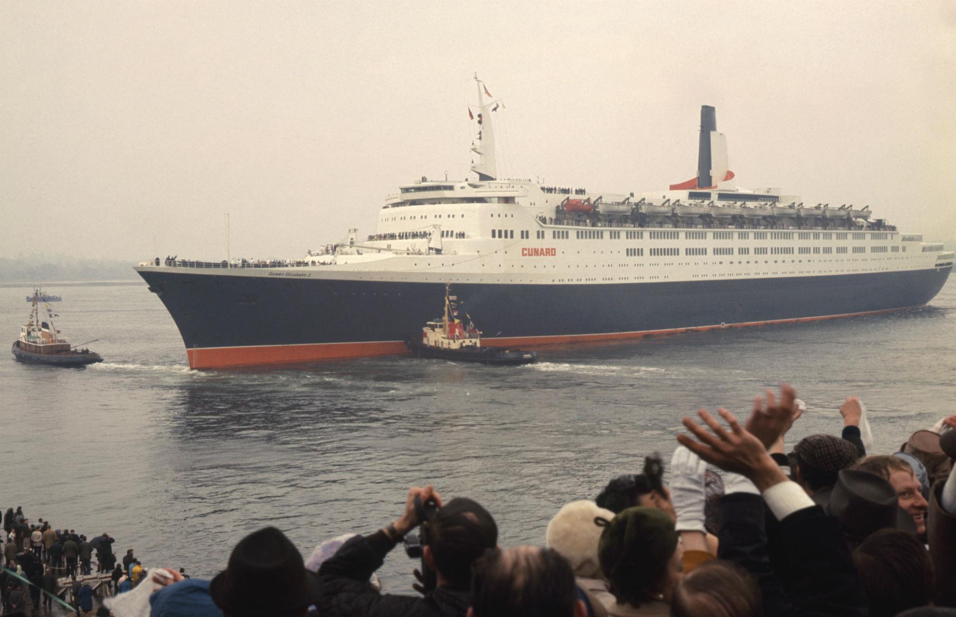 <p>Another iconic luxury liner built by Cunard, the 963-foot-long (293m) Queen Elizabeth 2 (or QE2 as it's better known) set sail on her maiden voyage from Southampton to New York in May 1969, with crowds of well-wishers (pictured) waving her off. In her 39 years at sea, the QE2 completed 806 Atlantic crossings and 25 trips around the world, racking up millions of nautical miles as a cruise liner and, for a brief stint, a troopship in the Falklands War. </p>