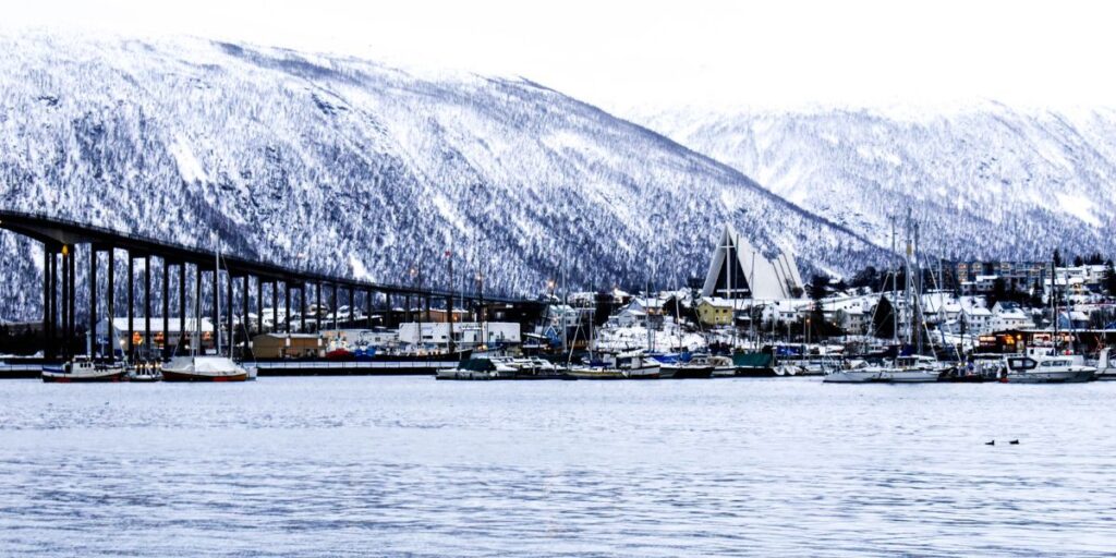 <p><span>Known as the "Gateway to the Arctic," Tromsø, Norway, is the perfect destination for explorers looking to start their Arctic adventures and is about 220 miles north of the Arctic Circle. Many people venture to Tromsø for hunting, fishing, and seeing the Northern Lights.</span></p><p><span>Whether you prefer taking in scenic views from Mount Storsteinen via cable car or exploring the stunning Arctic Cathedral, Tromsø offers a wealth of attractions during the winter months, including Northern Lights, dog sledding through snowy landscapes, and whale watching in the fjords.</span></p><p><span>One of the best times to visit Tromsø is during the autumn months of September and October. This is a great time to catch the Northern Lights without the extremely negative temperatures that come in the dead of winter. The temperature usually ranges from the mid-30s to low 50s °F, but be sure to pack your rain jacket as there is considerable rainfall during this period.</span></p>