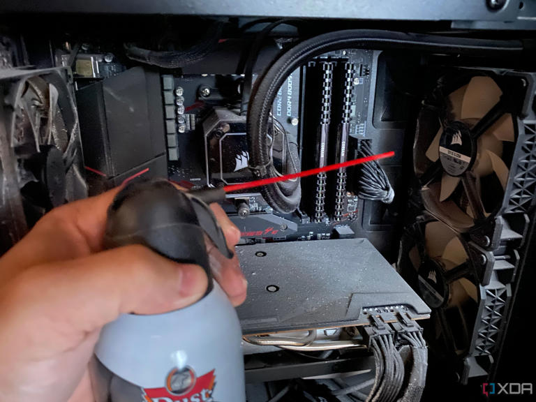 Blowing out dusty PC case with canned air