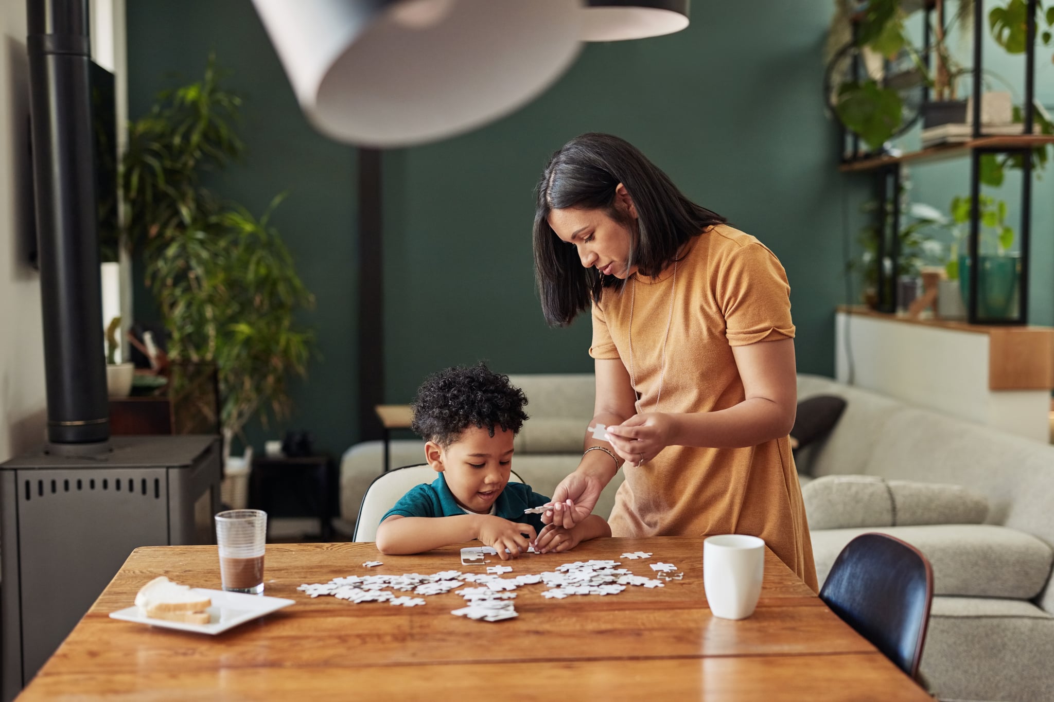 <p>Even young infants and toddlers can partake in this activity using large or peg puzzles. Older children can help put together intricate jigsaw puzzles. This indoor idea is well-suited for independent play, but families can divide and conquer larger puzzles together for a bonding experience.</p>