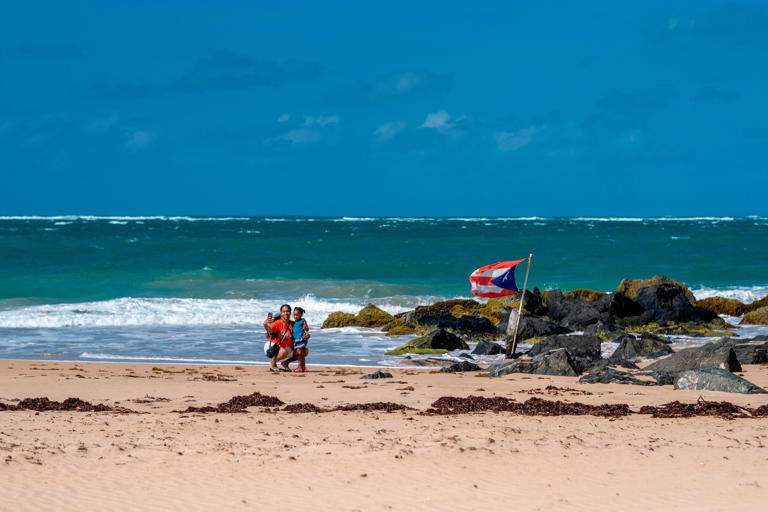 Tourists are seen on the beach in the El Condado area near San Juan.