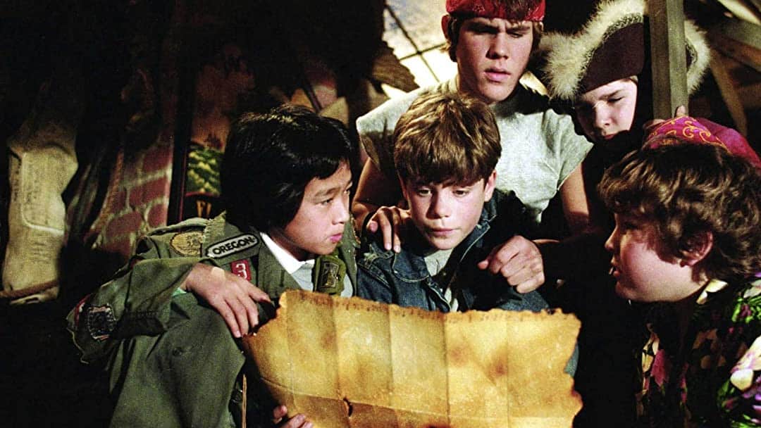 <p>A group of young misfits embark on a thrilling adventure to find a pirate’s treasure and save their beloved neighborhood from being demolished. Along the way, they encounter booby traps, a family of criminals, and the legendary One-Eyed Willie. Starring Sean Astin, Josh Brolin, and Corey Feldman, <em>The Goonies</em> is a beloved coming-of-age tale that has entertained generations with its fun-loving spirit and unforgettable characters.</p>