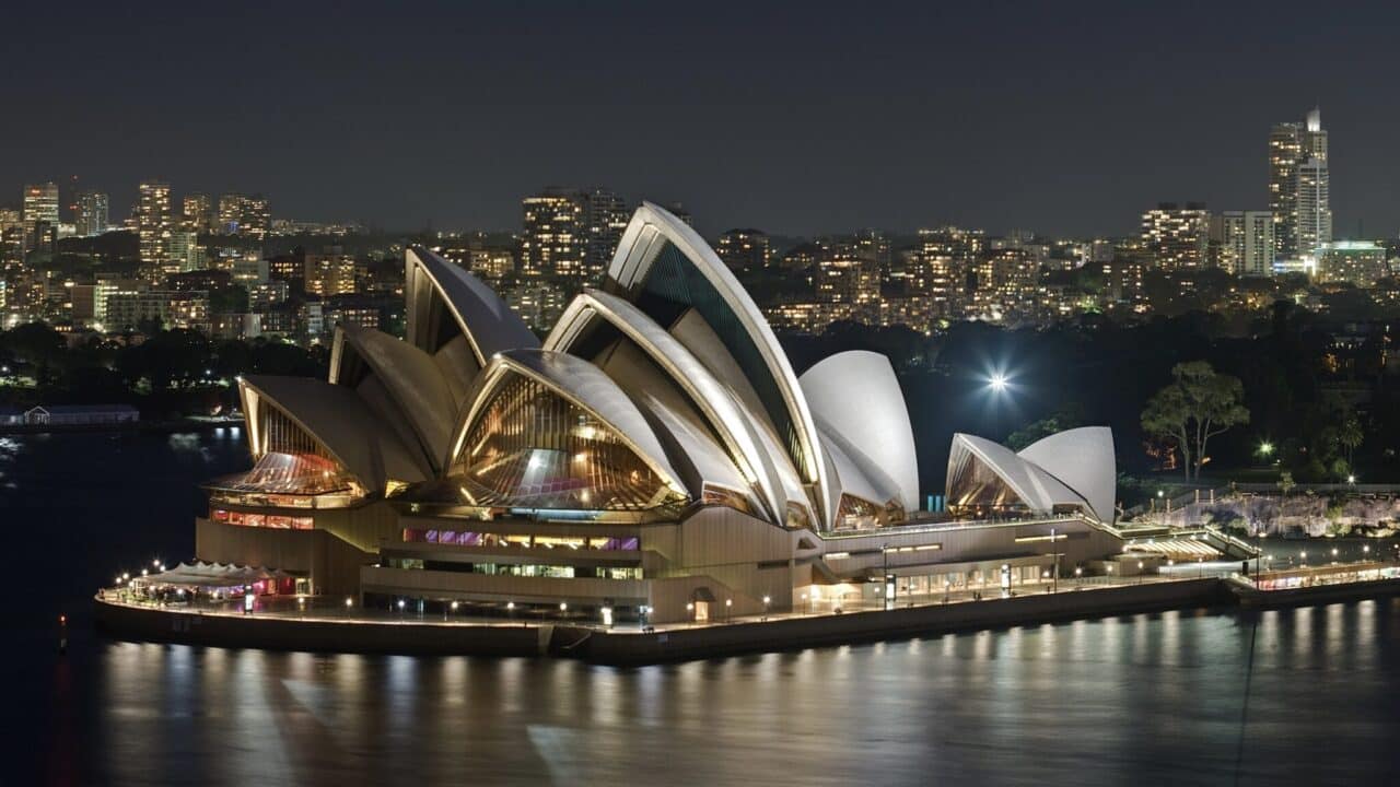 <p>The <a href="https://wealthofgeeks.com/opera-house/">Sydney Opera House</a> is an architectural masterpiece that graces the Sydney waterfront. It’s just celebrated its 50th anniversary. While building commenced in 1959, it took 14 years before it was completed. You can also take a tour. This iconic venue hosts various performances, from world-class operas to contemporary concerts. Its distinctive sail-like design makes it a must-see for visitors, and it features heavily as a backdrop for the new <em>NCIS</em> series. </p>