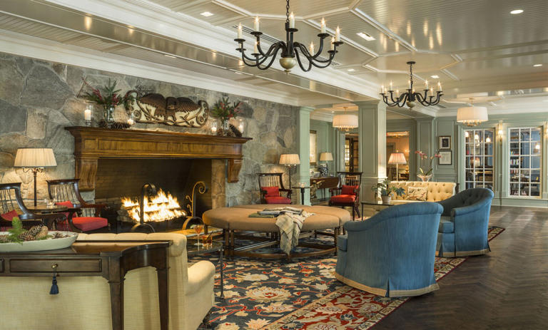 Interior of Woodstock Inn & Resort, chairs by a fire.