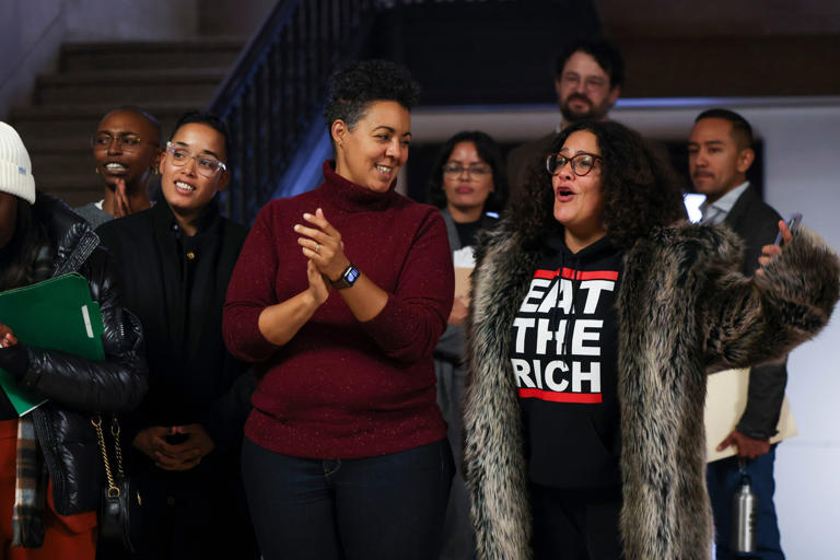 Ald. Jessie Fuentes, 35th, from left, Ald. Maria Hadden, 49th, and Ald. Rossana Rodriguez-Sanchez, 33rd, celebrate during a press conference after a vote to authorize a referendum question for voters to fund homeless services passed, Oct. 31, 2023.