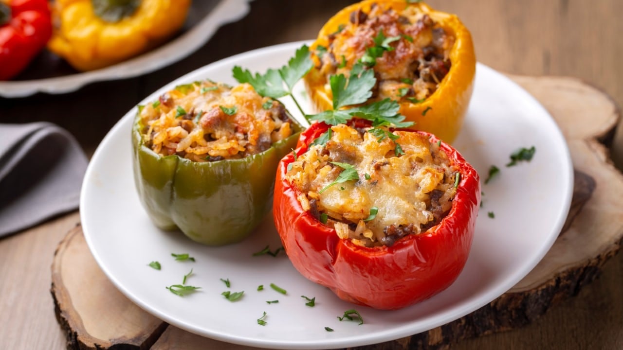 <p>Stuffed peppers can be appetizers or part of the main course. Usually, they’re stuffed with ground beef, but these are loaded up with gooey macaroni and cheese. Carve out little jack-o-lantern faces on the side of each pepper.</p>