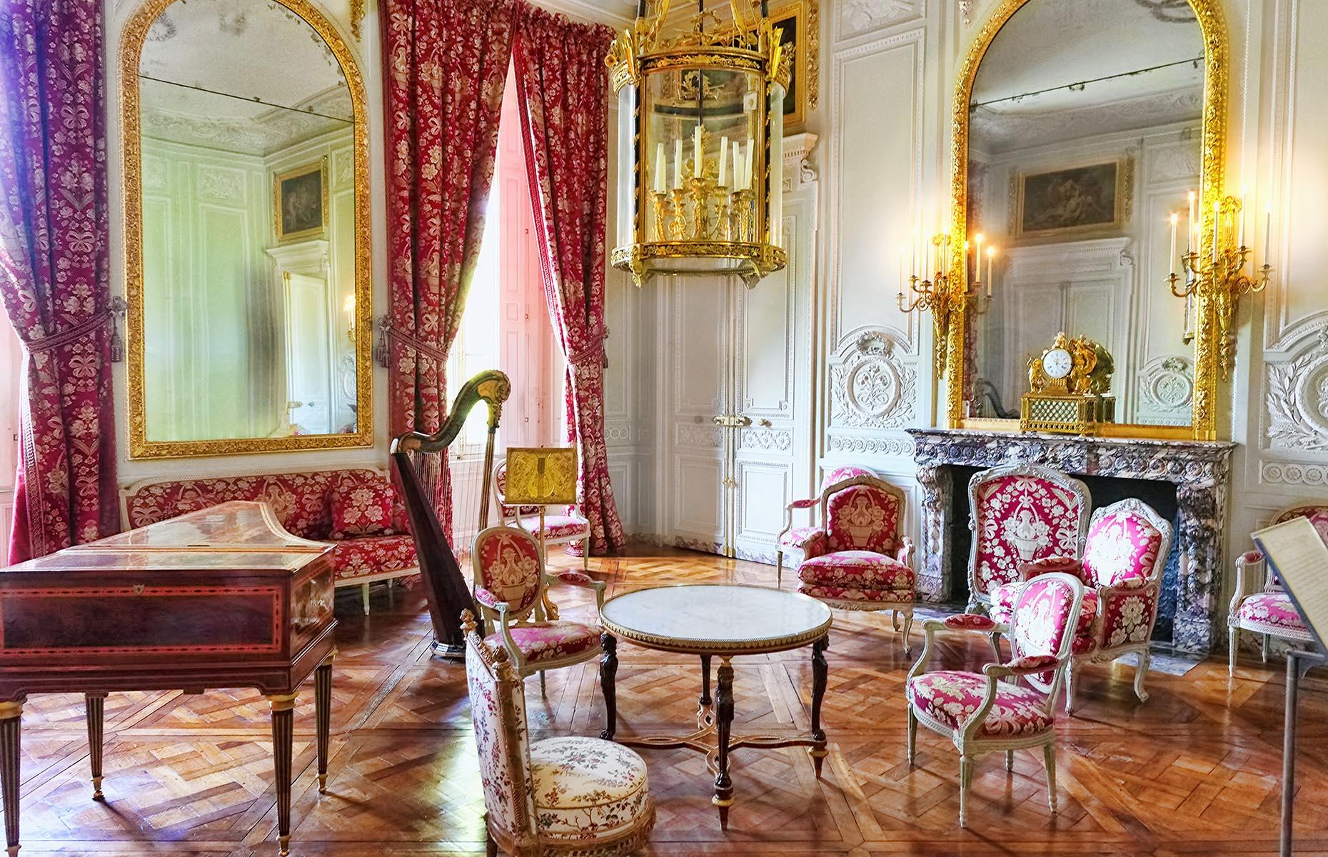 <p>One truly stand-out room within the Petit Trianon is the Boudoir, designed with a soothing baby blue color palette and intricate white carvings adorning the walls.</p>  <p>Meanwhile, the Salon (pictured), where Marie Antoinette entertained her guests, boasted a regal color scheme of pale green and white, with pops of fuchsia, plush floral furnishings, and gold accents.</p>