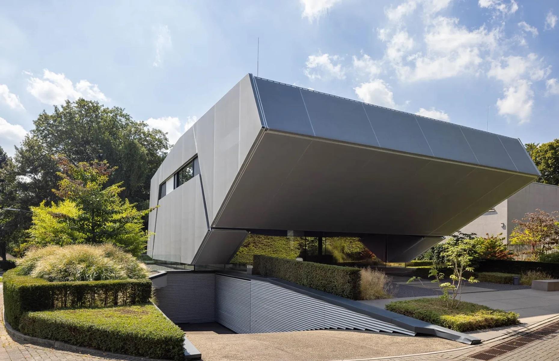 <p>The antipode of traditional, this extraordinary German villa resembles a <a href="https://www.loveproperty.com/gallerylist/84471/amazing-ufo-homes-that-are-out-of-this-world">spacecraft</a> and is all sharp angles and metal. Listing agents, <a href="https://www.sothebysrealty.com/eng/sales/detail/180-l-85631-82n9je/avant-garde-luxury-villa-on-the-landscape-conservation-area-dusseldorf-nw-40629">Sotheby's International Realty</a>, described the place as embodying “modern architecture in its purest form,” with a “geometrically cut body” that floats “weightlessly above a glass joint.” </p>