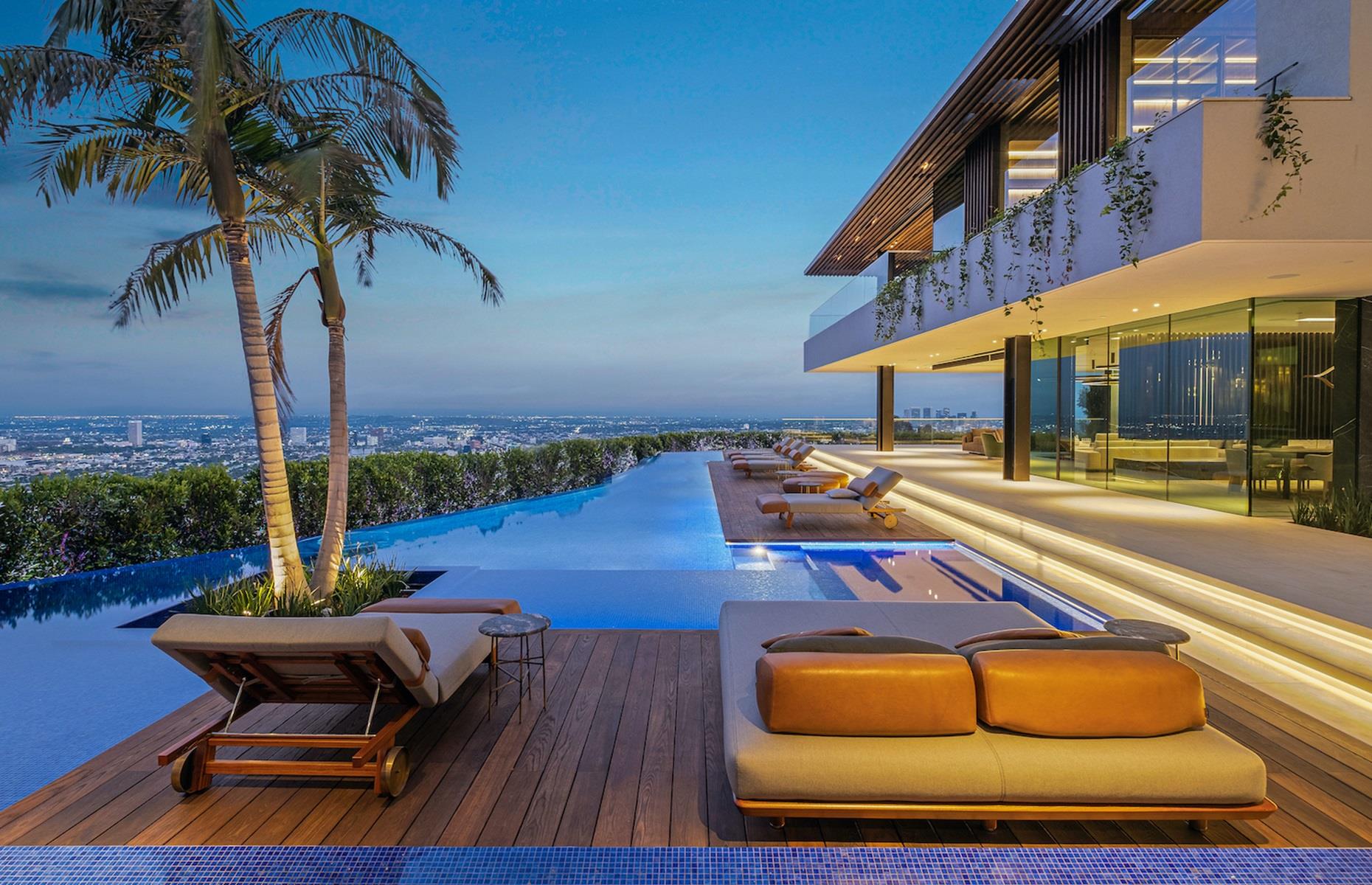 <p>The backyard is also home to a 15-foot outdoor television, which rises from the ground with horizontal and vertical rotation, making it visible from every single room in the house. The pad also benefits from an enormous rooftop deck, with <a href="https://www.loveproperty.com/gallerylist/72934/homes-with-jaw-dropping-views">unrivalled views</a>. To ensure this, the property's developer apparently forked out over £328,580 ($400k) to have the power lines removed from the surrounding area. Talk about going above and beyond! </p>